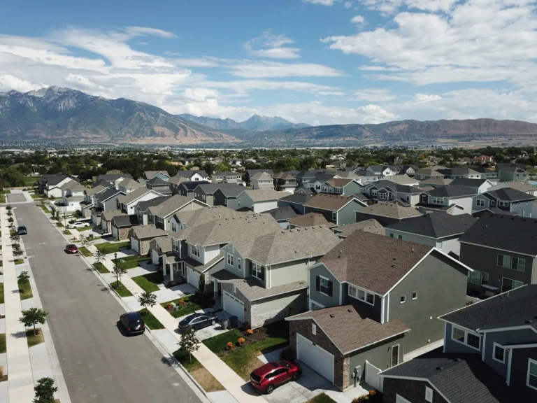 Drone camera shot of a neighborhood with buildings in Pleasant Grove